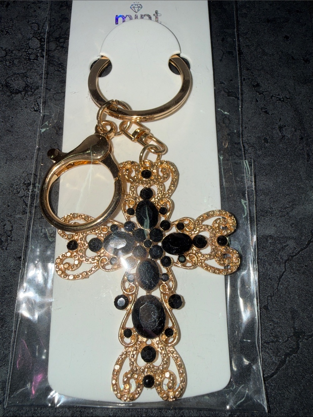 Gold-tone Cross Keychain with Black Gem Accents
